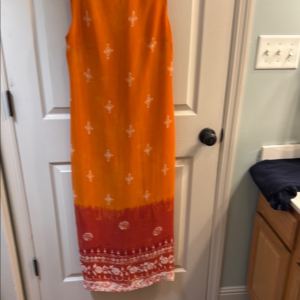 Orange and Red Sleeveless Dress with White Pattern
